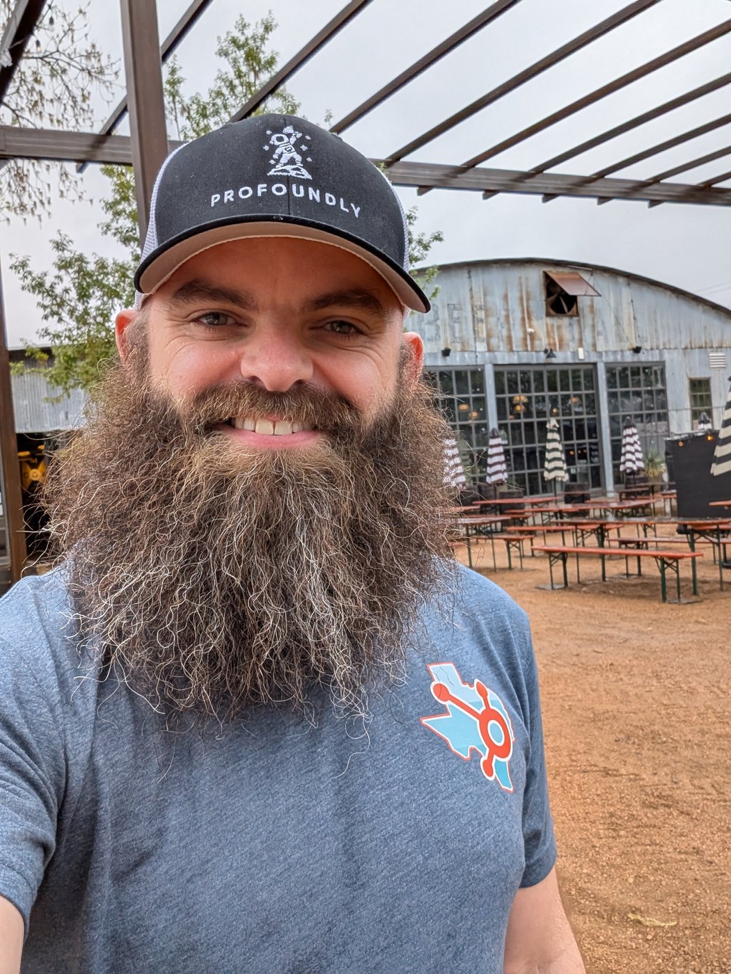 Chris Carolan in a Profoundly hat and HubSpot Texas tee